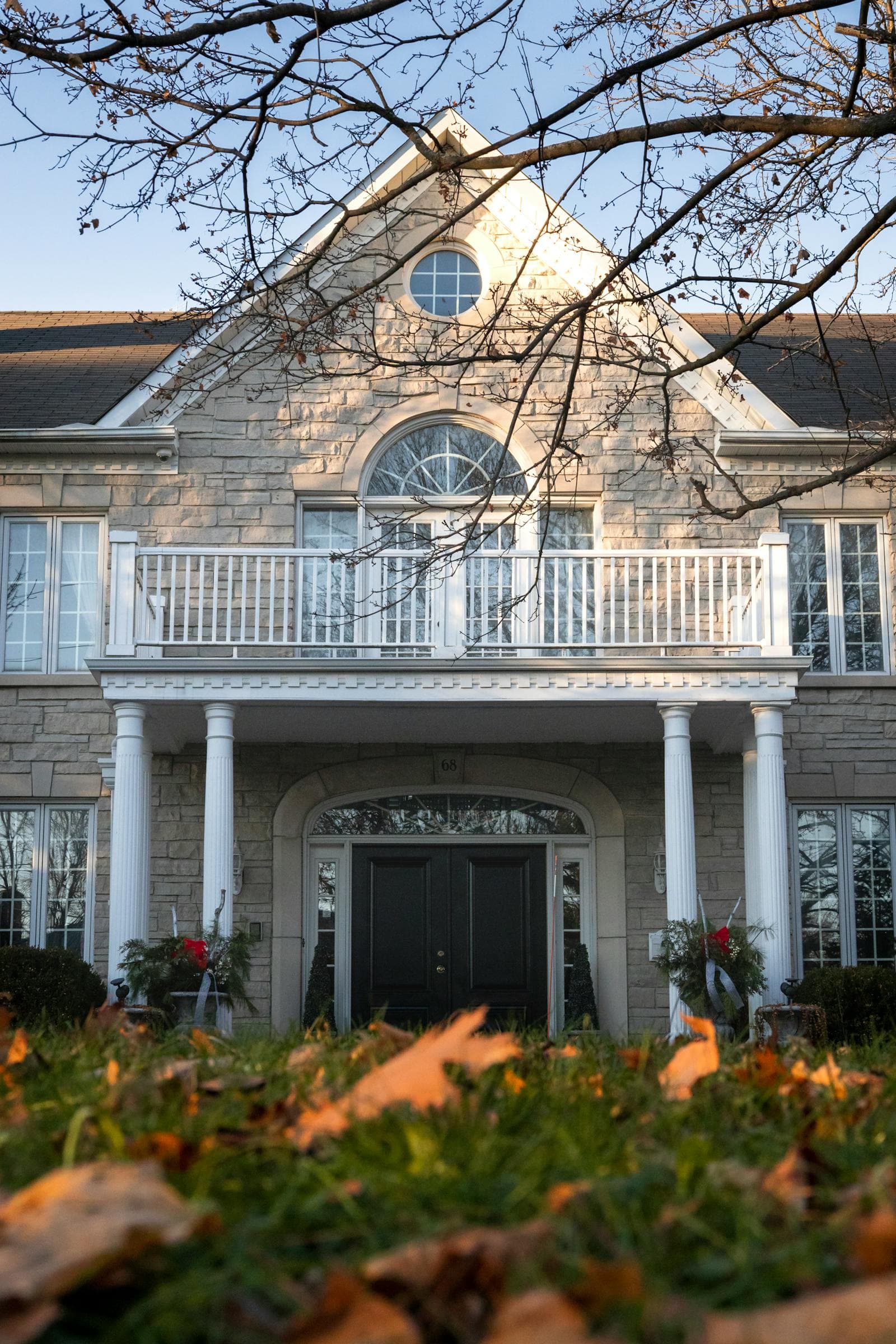 A yard covered in fall leaves during cleanup and end-of-season maintenance.